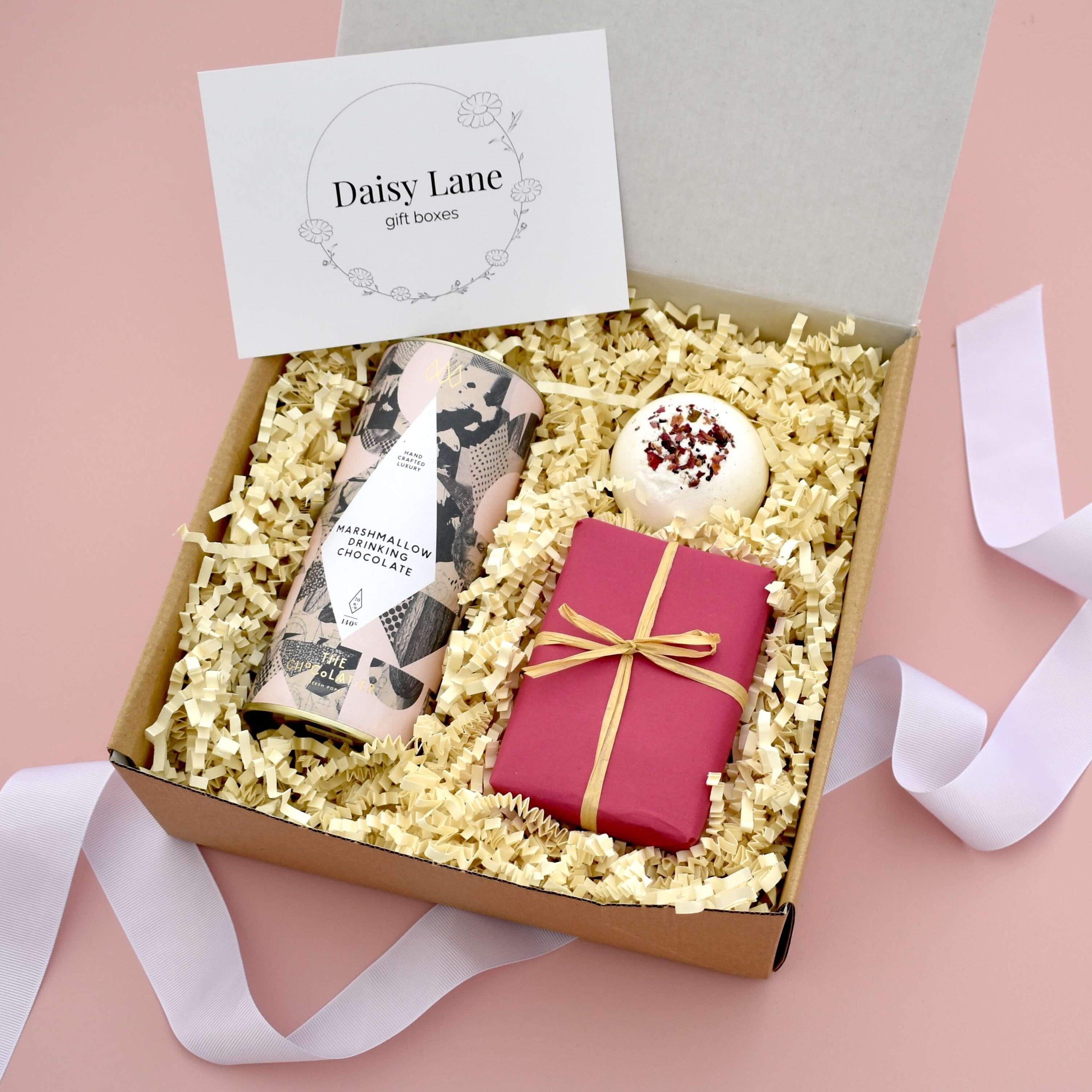 little care package gift box for her including hot chocolate shortbread floral bath bomb. Pink themed gift for her