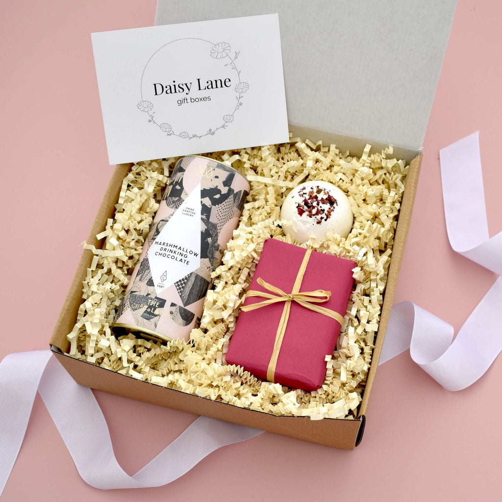little care package gift box for her including hot chocolate shortbread floral bath bomb. Pink themed gift for her